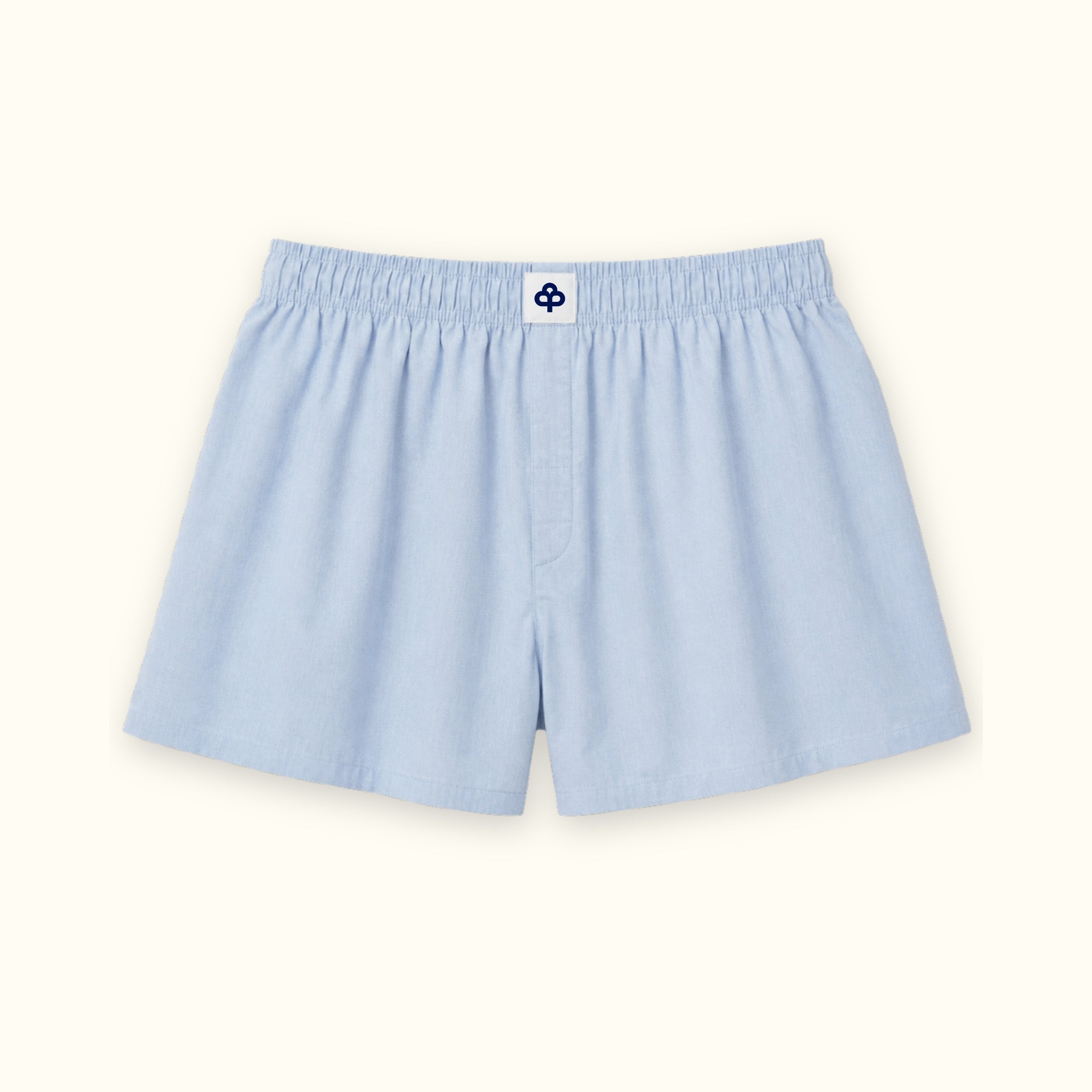 Short tipo bóxer de algodón en azul claro, vista frontal, mostrando la cintura y la forma de la pernera