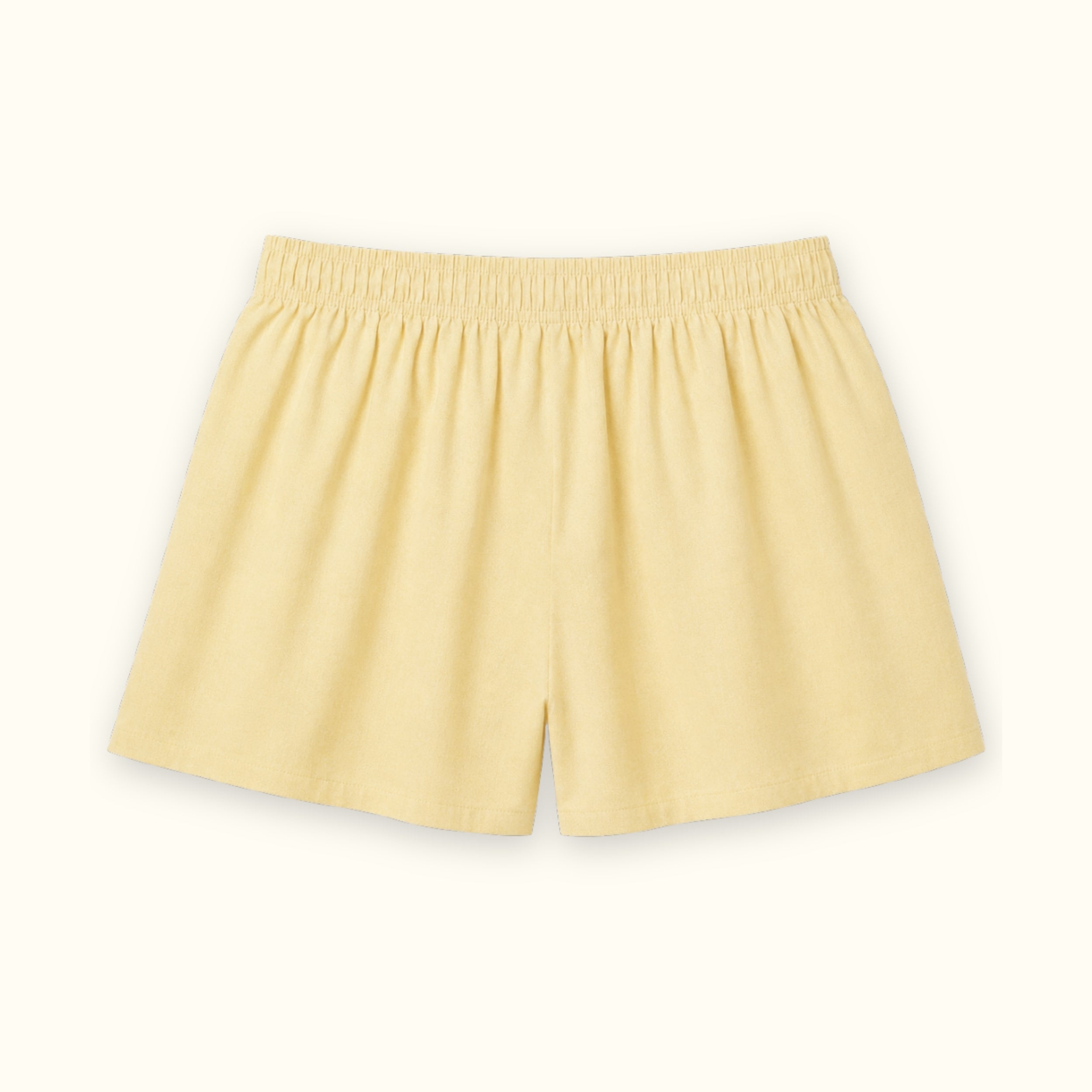 Short tipo bóxer de algodón en Oxford amarillo claro, vista trasera, mostrando la cintura y la forma de la pernera