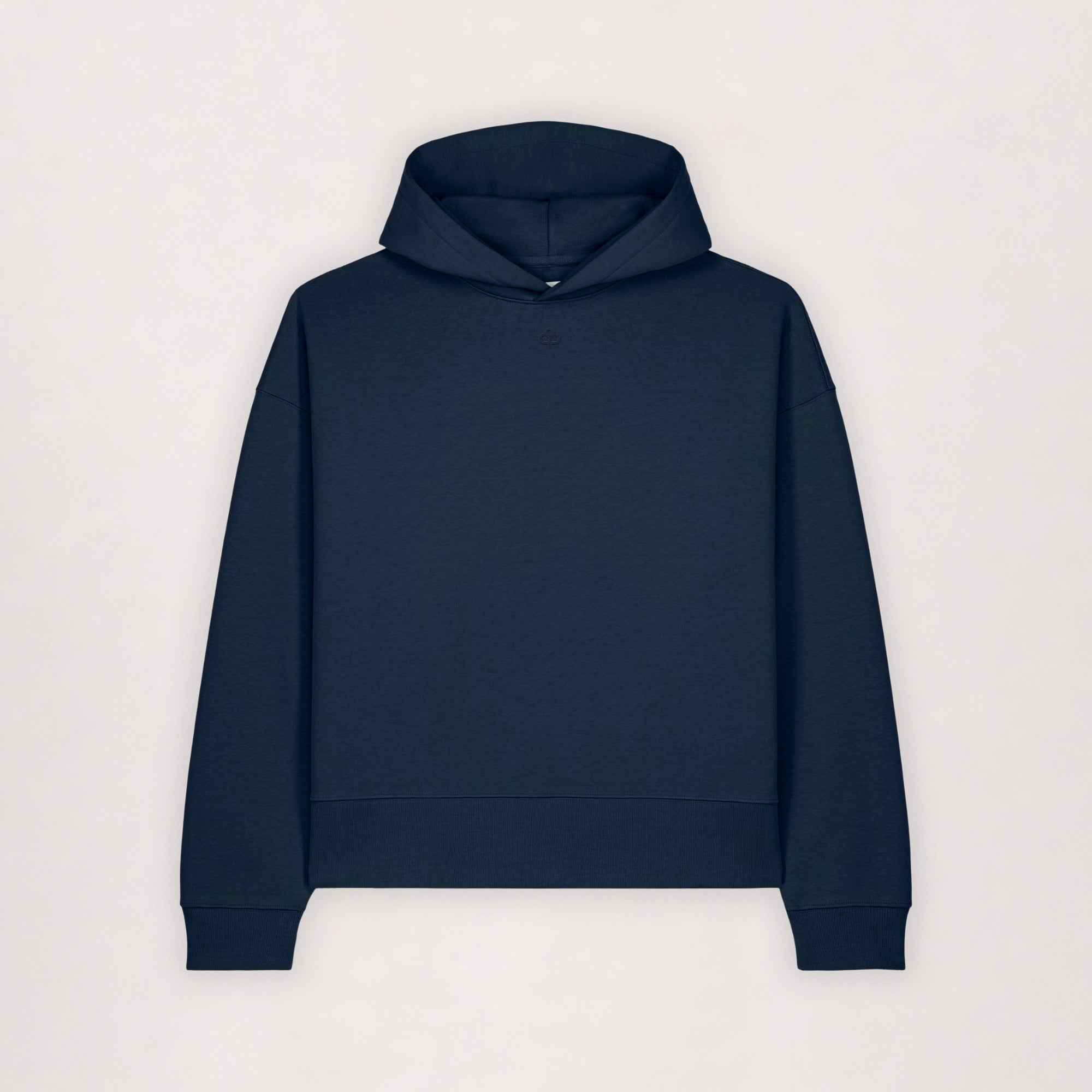 Oversize cotton hoodie in navy, flat lay front view with ribbed hem